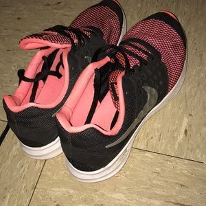 Pink and black nike shoes